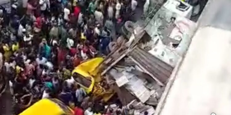 Truck Falls Off Bridge, Crashes Into Two Buses In Lagos